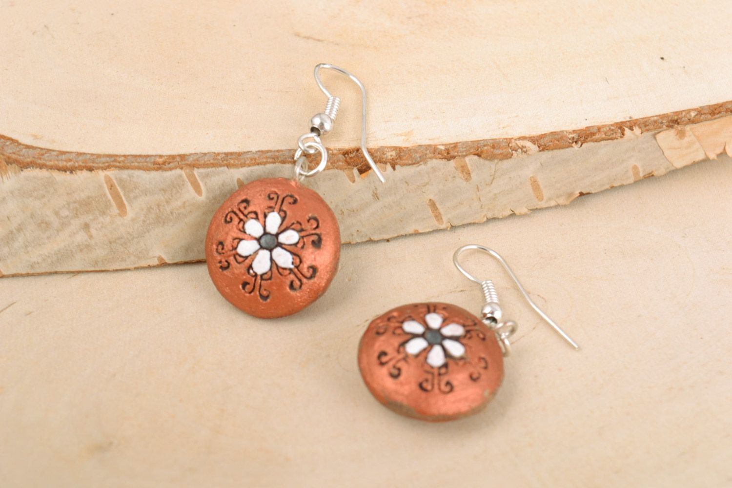 Small handmade round brown ceramic dangling earrings in boho chic style photo 1