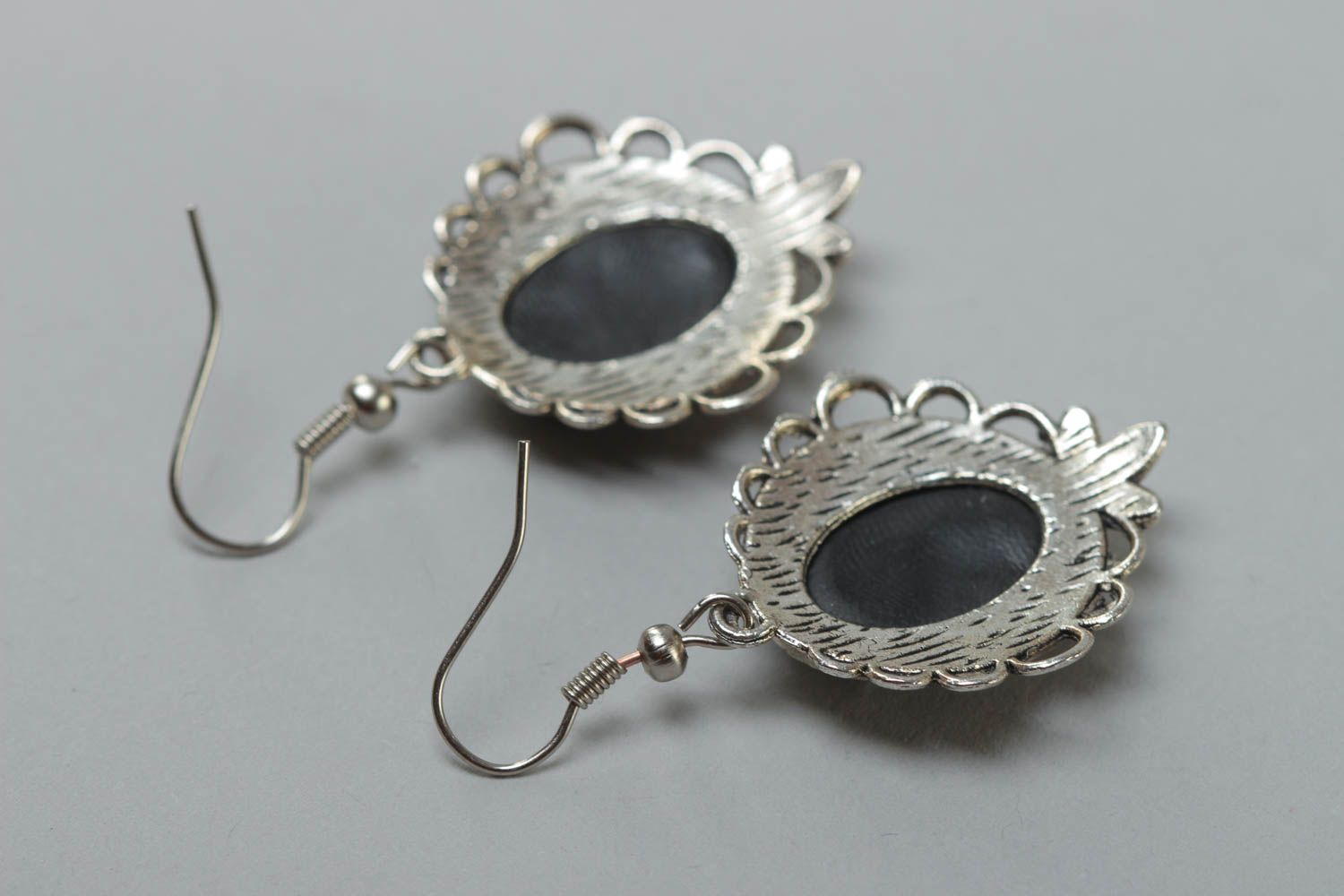 Black handmade oval polymer clay earrings in metal frame photo 4