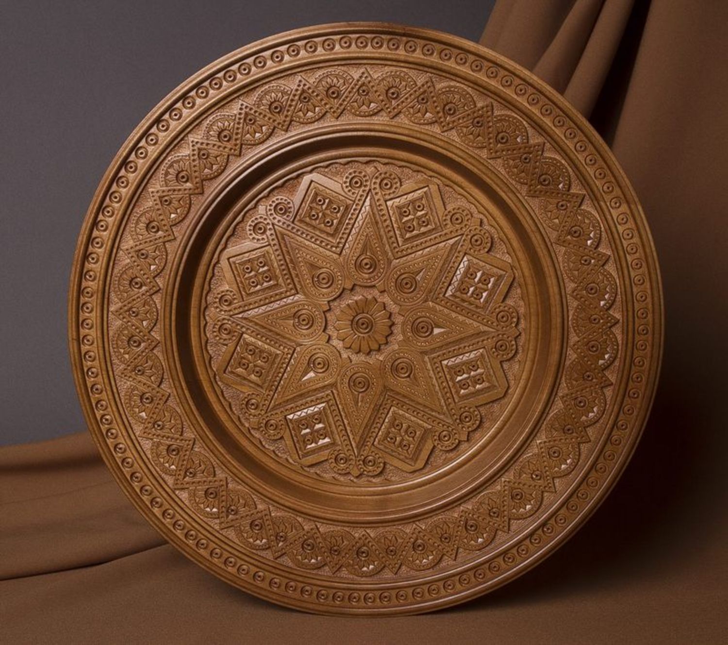 Carved decorative plate made ​​of wood photo 1