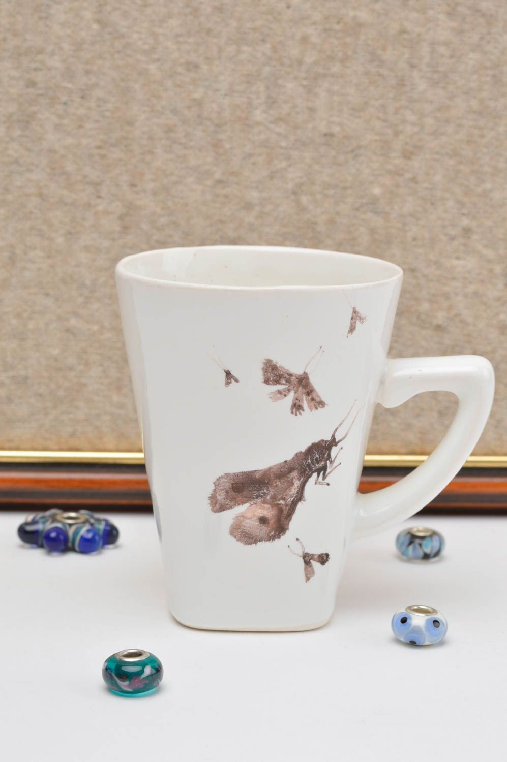 White porcelain teacup with handle and hand-painted pattern photo 1