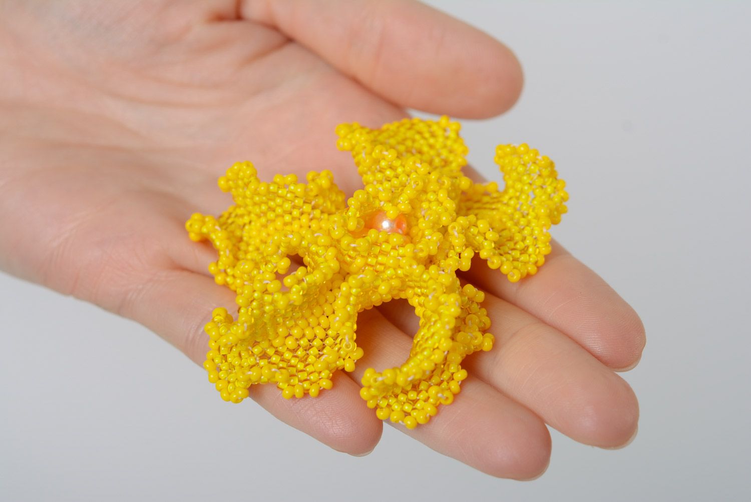 Beautiful bright yellow brooch woven of beads in the shape of volume flower photo 2