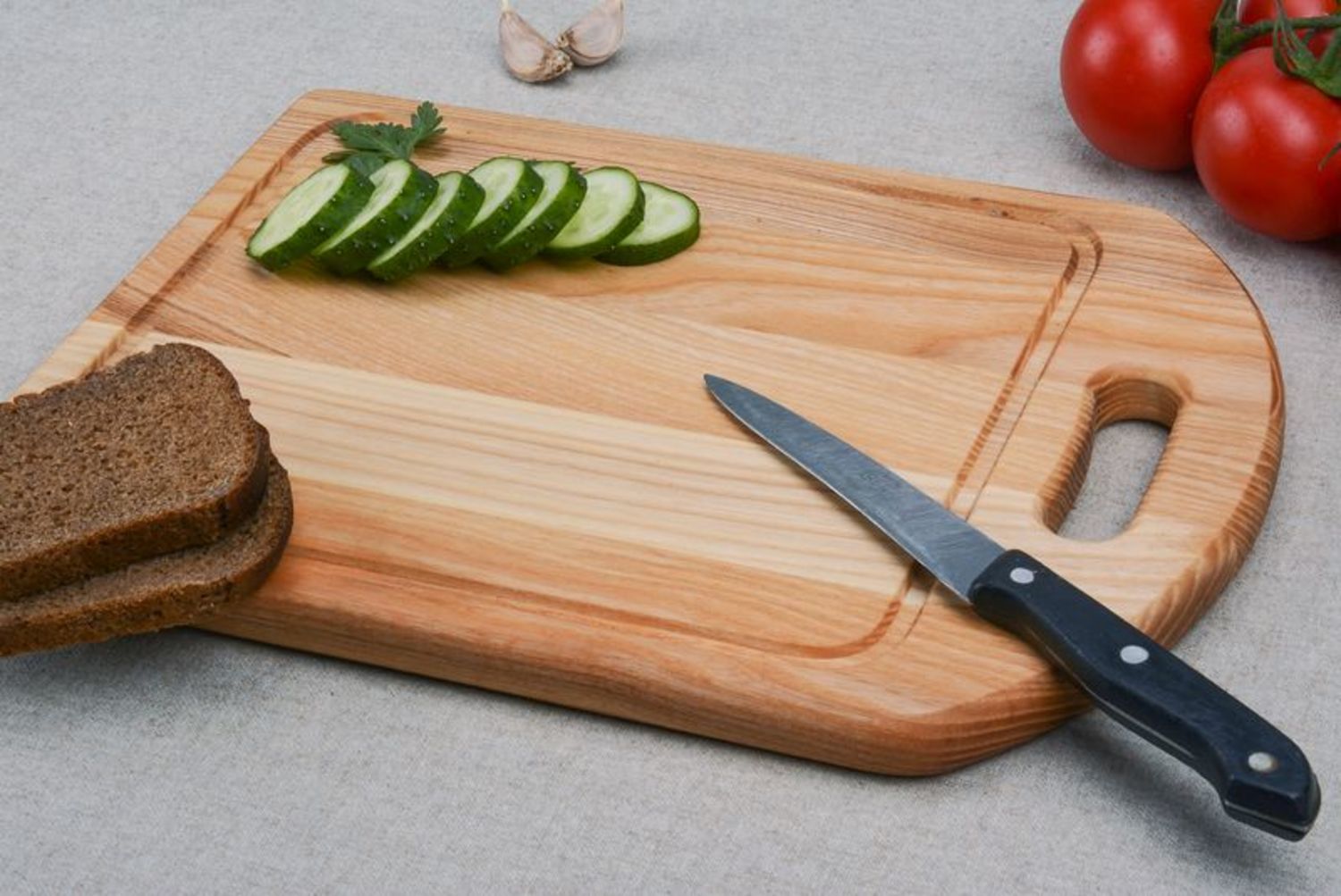 A wooden cutting board photo 1