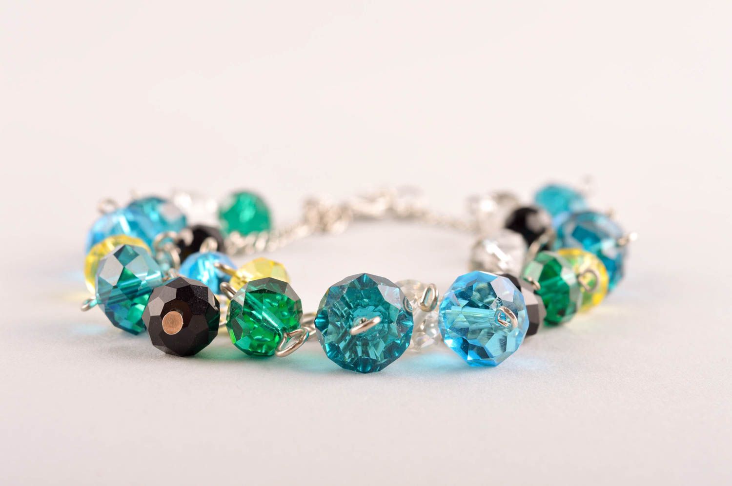 Handmade chain beaded bracelet made of transparent yellow, green, blue beads for young girls photo 3