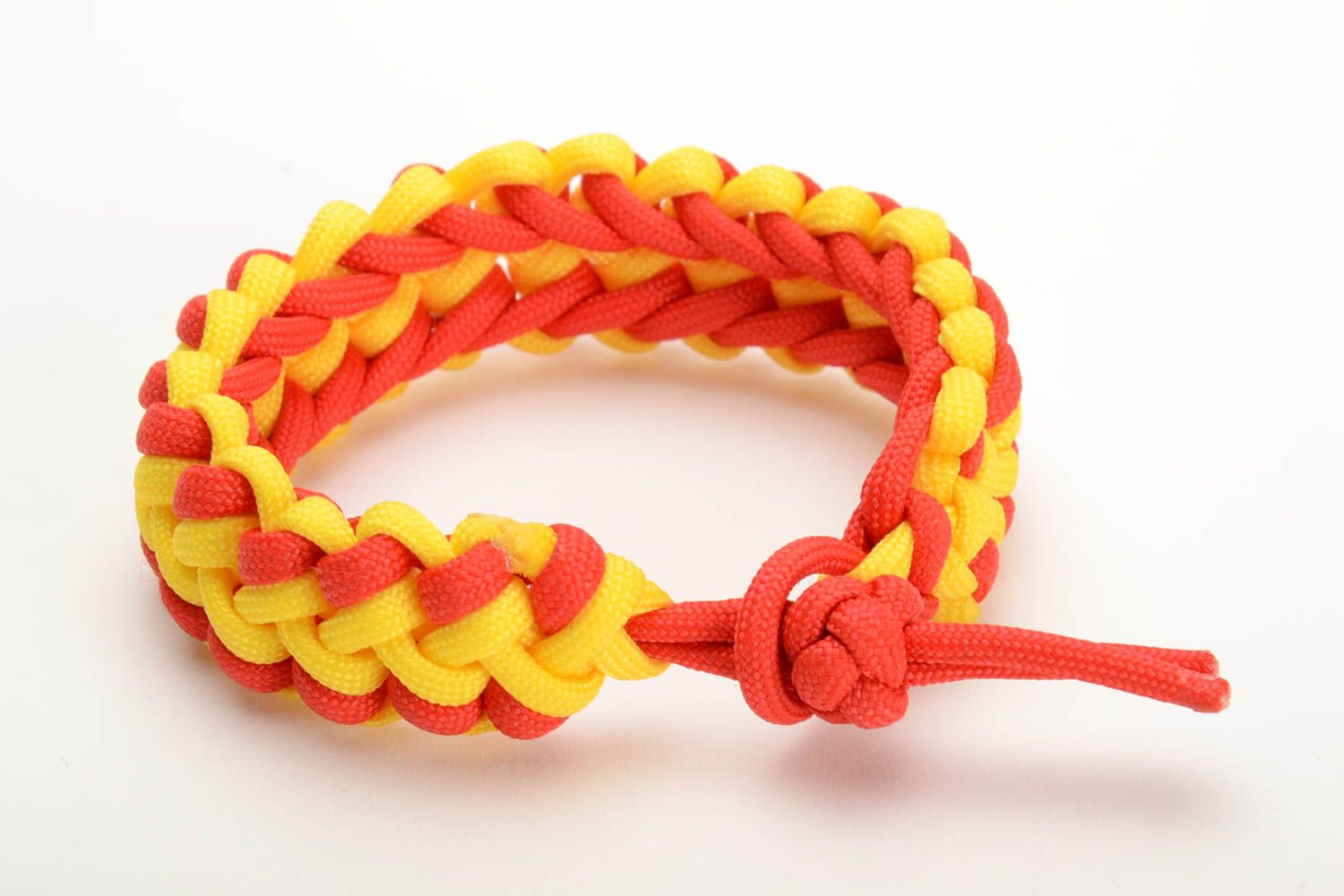 Red and yellow handmade wrist bracelet woven of American paracord photo 3