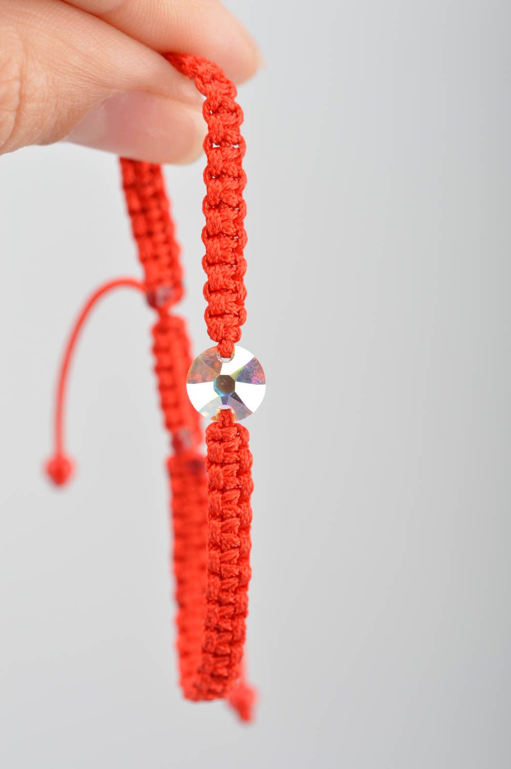Festive red handmade bracelet made of silk threads with strass on strings photo 3