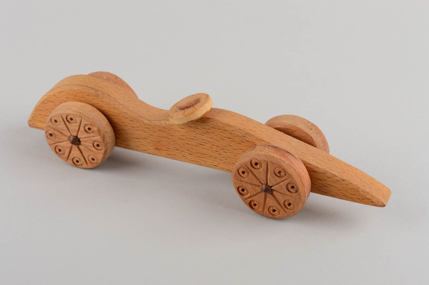 Handmade designer carved wooden wheeled toy car for children eco photo 2