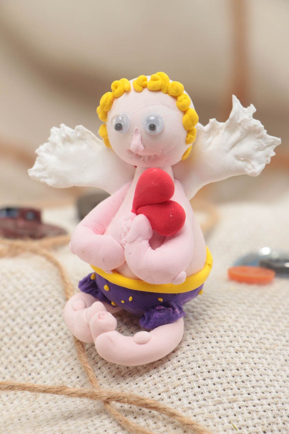 Miniature handmade souvenir polymer clay figurine of angel photo 1