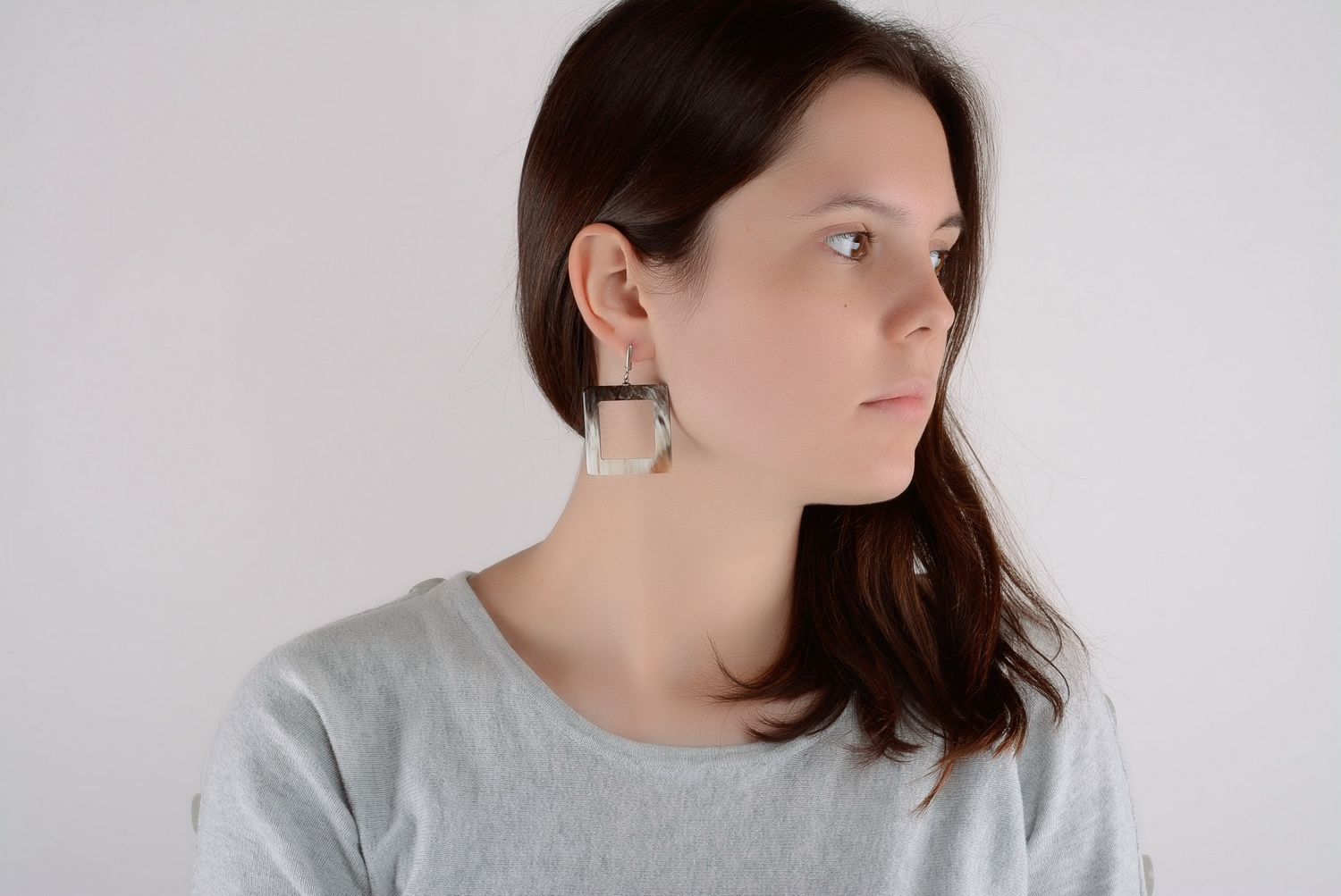 Silver earrings with horn photo 1