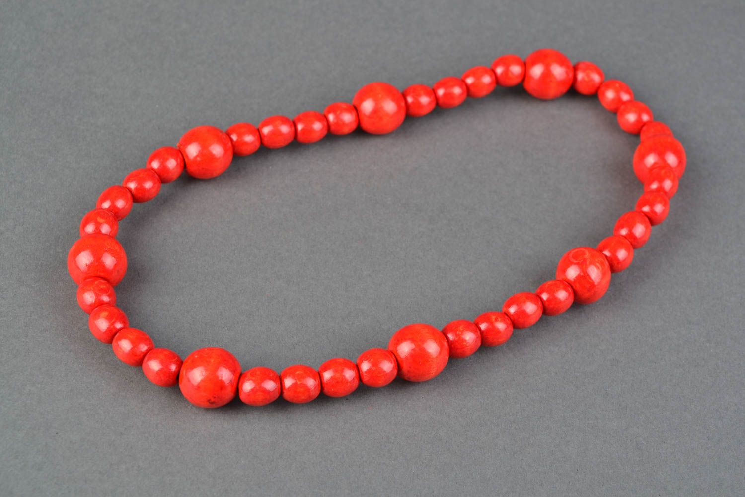 Red necklace with large wooden beads photo 1