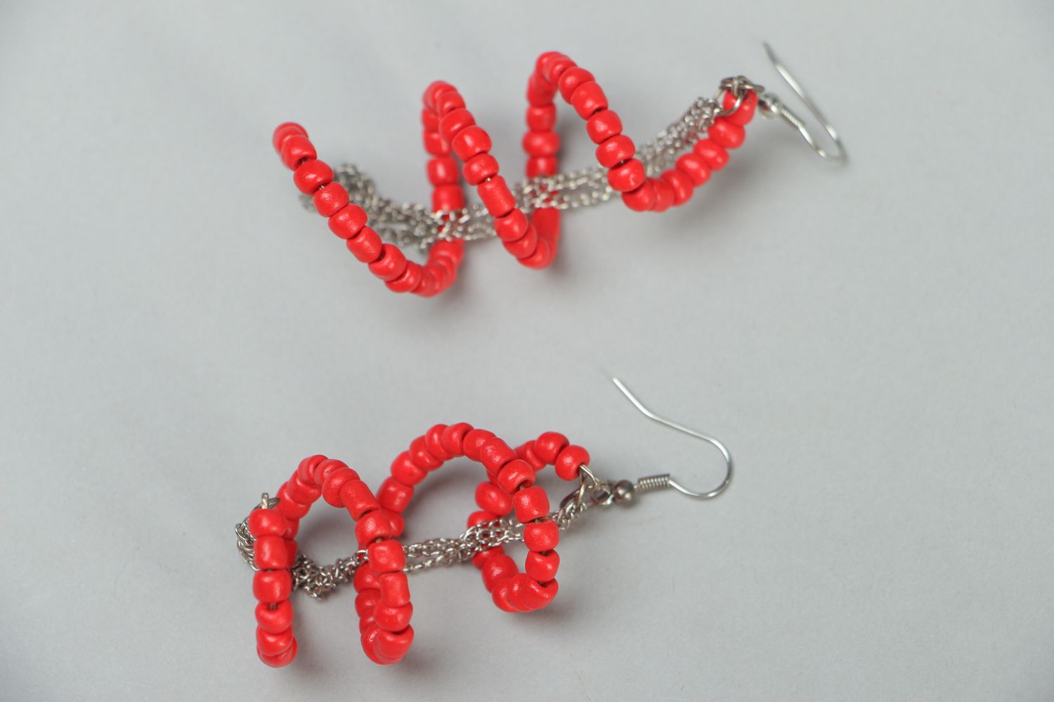 Long earrings with red plastic beads photo 1