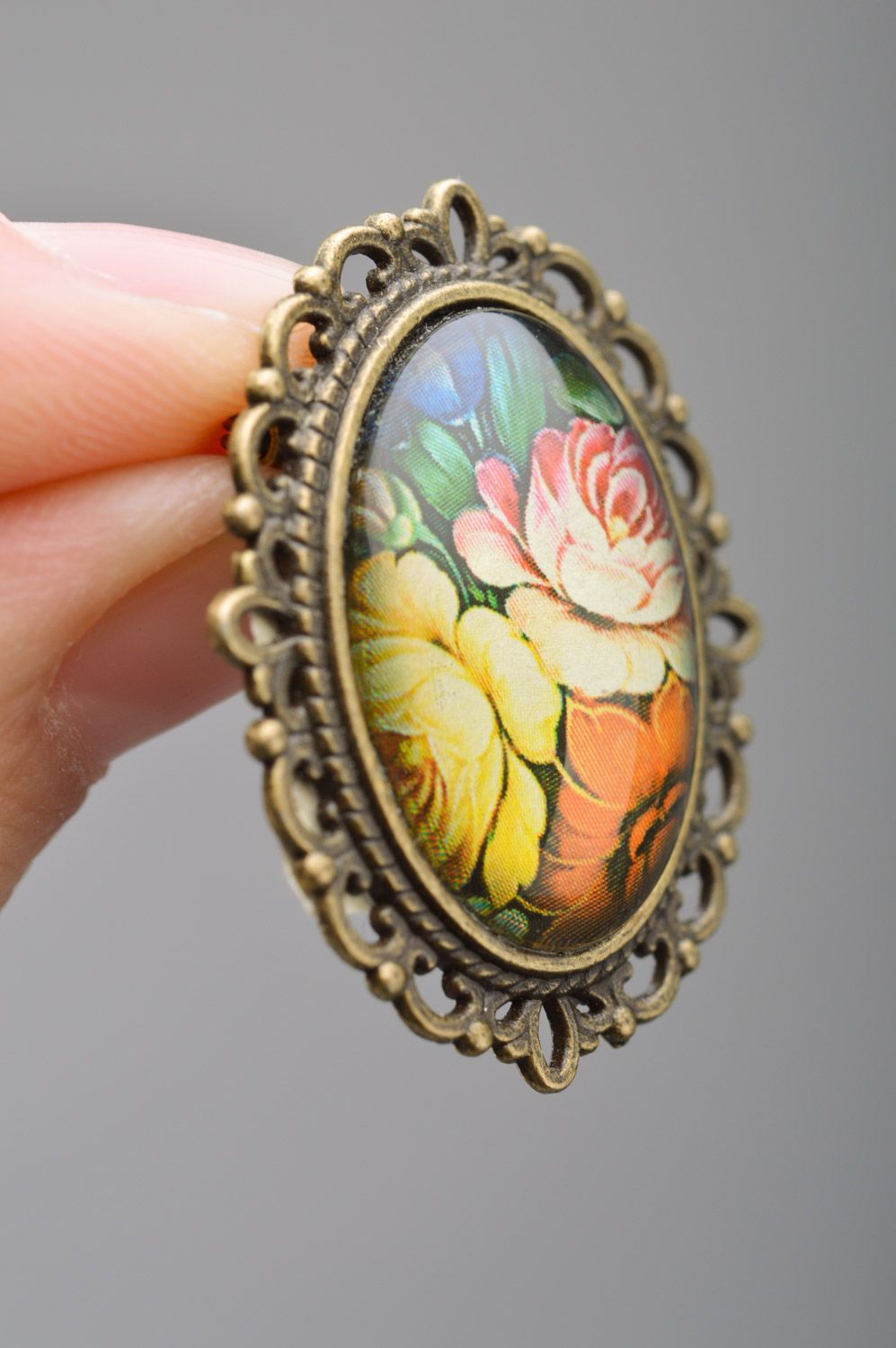 Handmade oval brooch with metal basis and floral pattern coated with glass photo 3