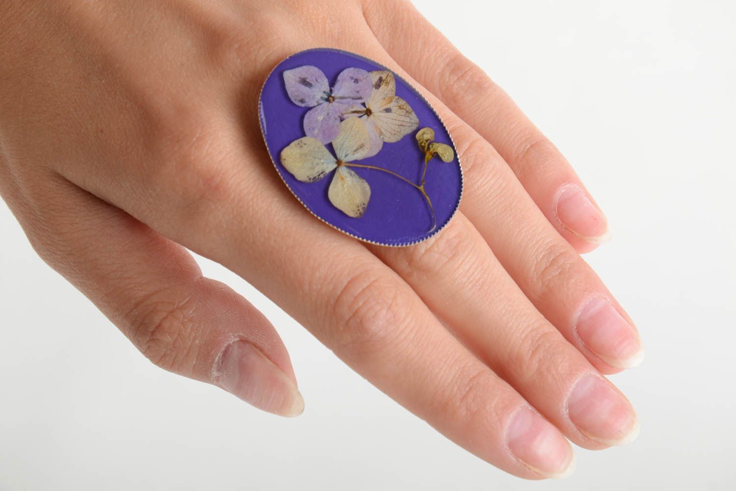 Handmade designer oval ring with dried flowers in epoxy resin on metal basis photo 5