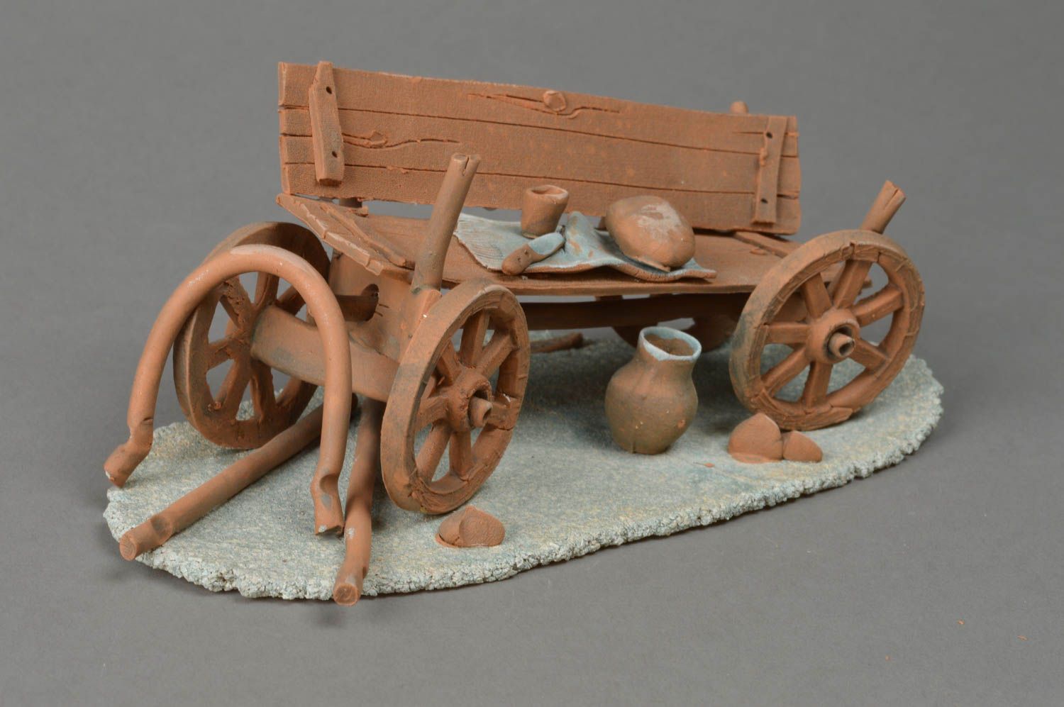 Handmade designer white red and chamotte clay figurine of cart table decoration photo 2
