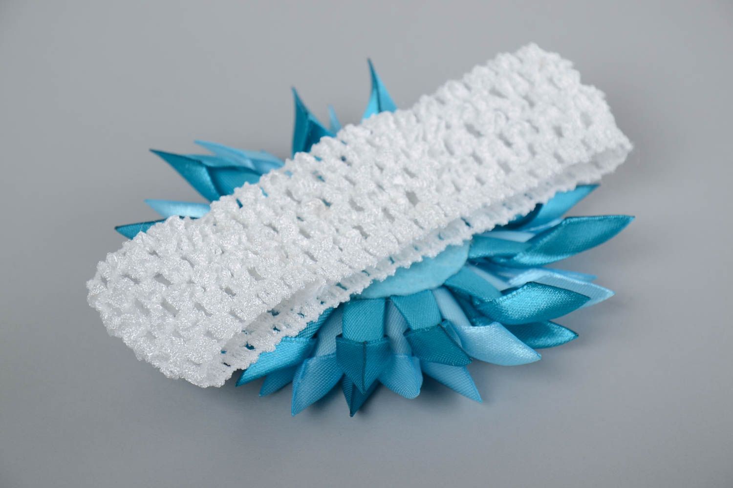 Children's white handmade elastic headband with blue satin flower photo 4