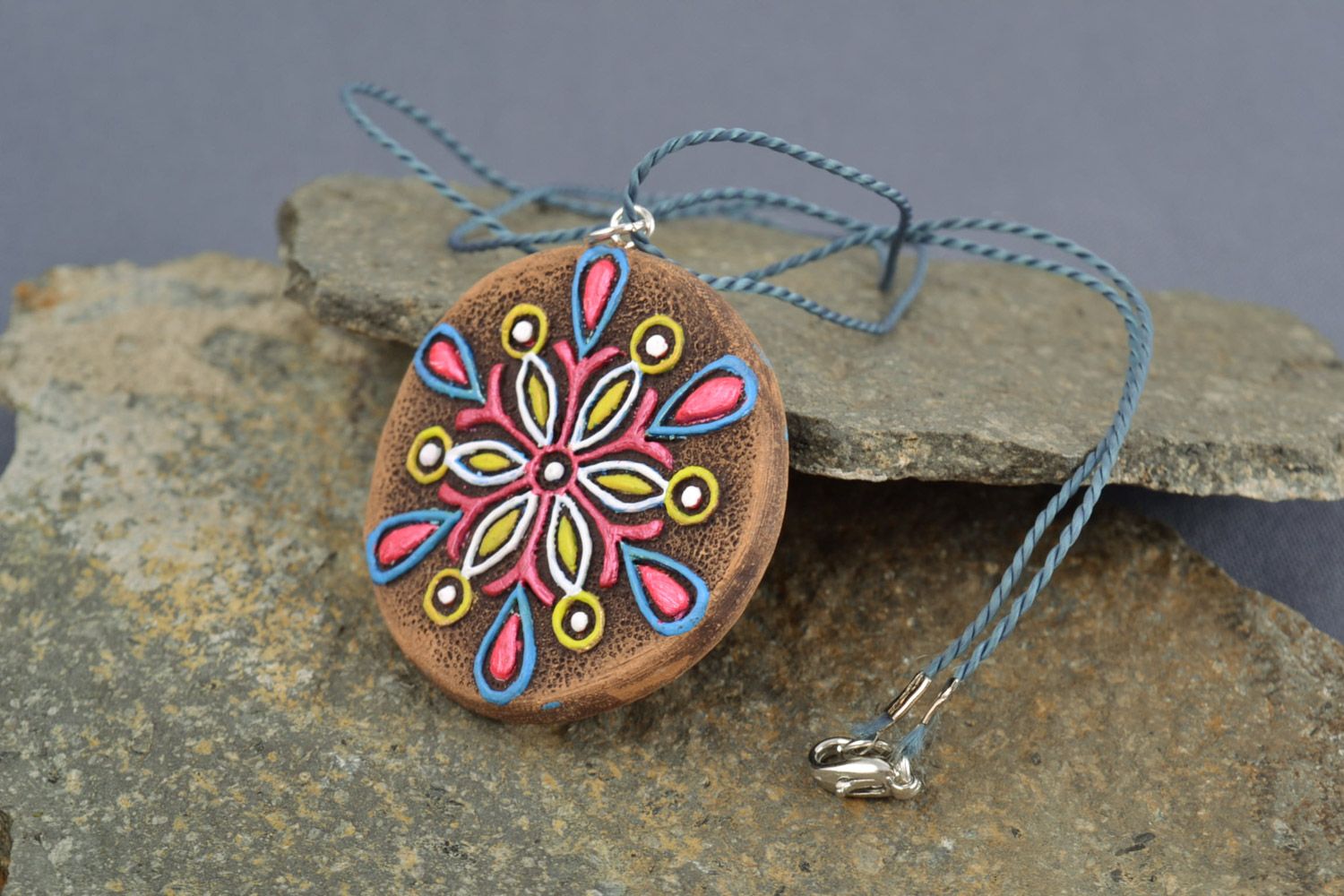 Round handmade clay neck pendant painted with acrylics with flower photo 1