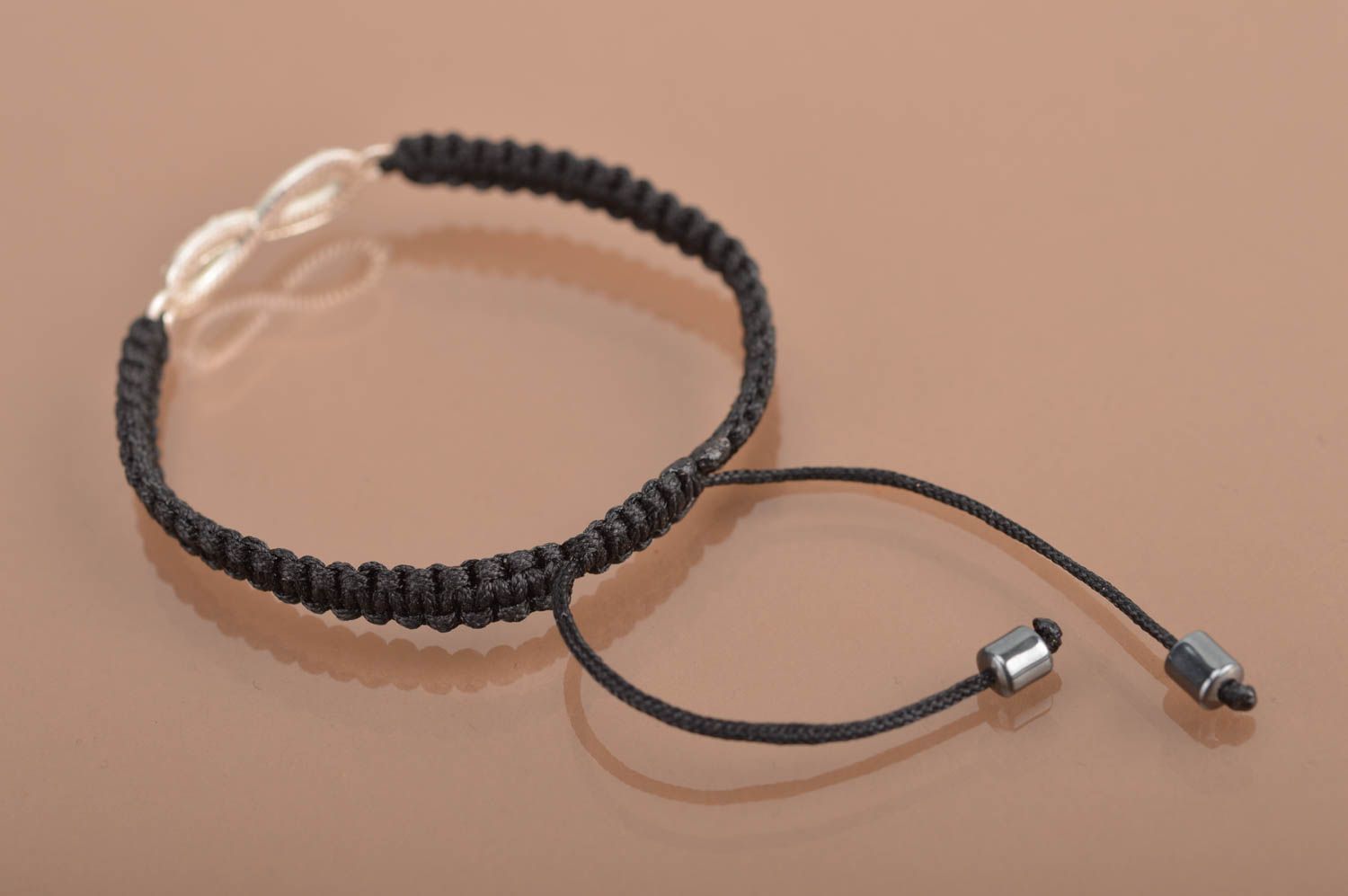 Handmade cute thin black woven wrist bracelet made of silk with insert photo 5