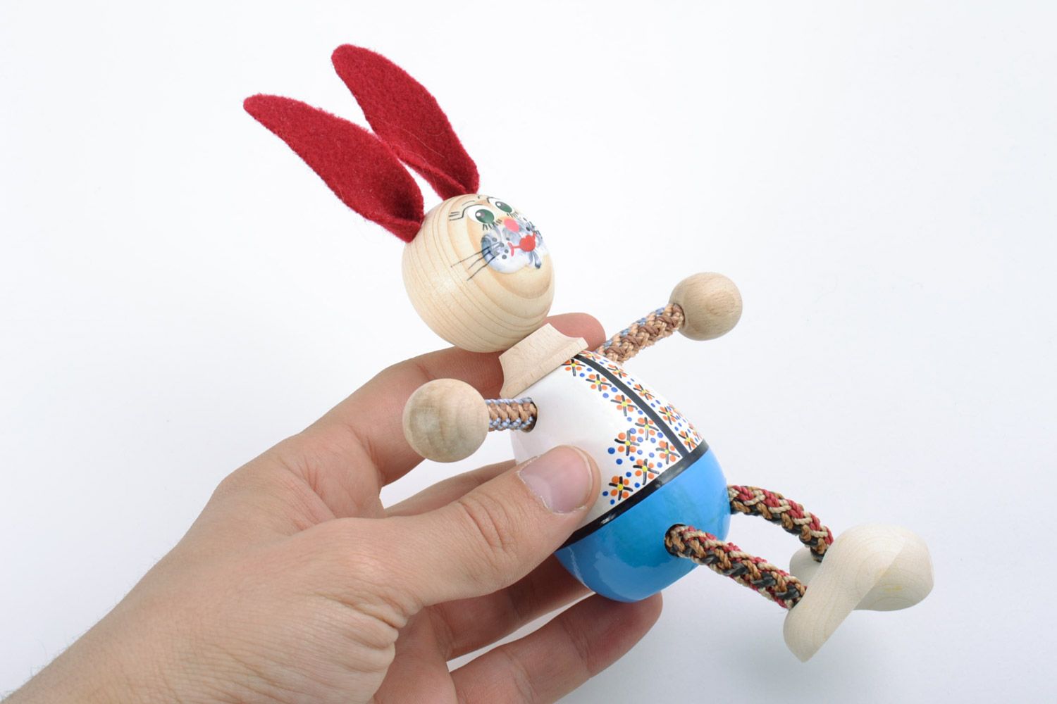 Homemade painted wooden eco toy in the shape of hare for children photo 2