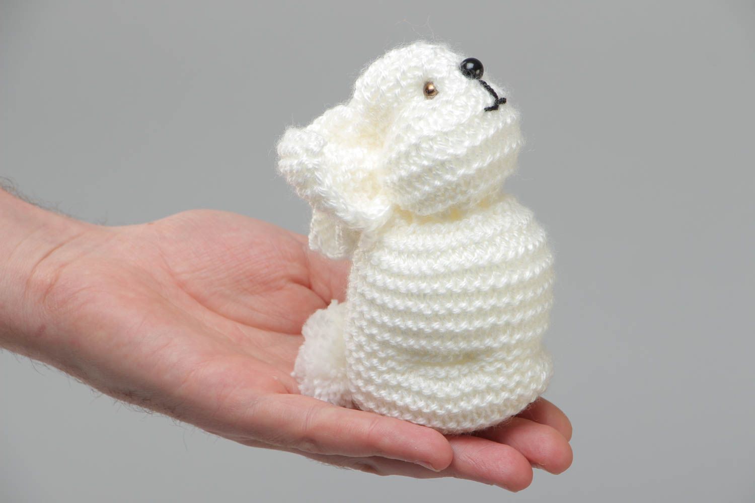 Handmade small soft toy knitted of white acrylic threads in the shape of rabbit photo 5