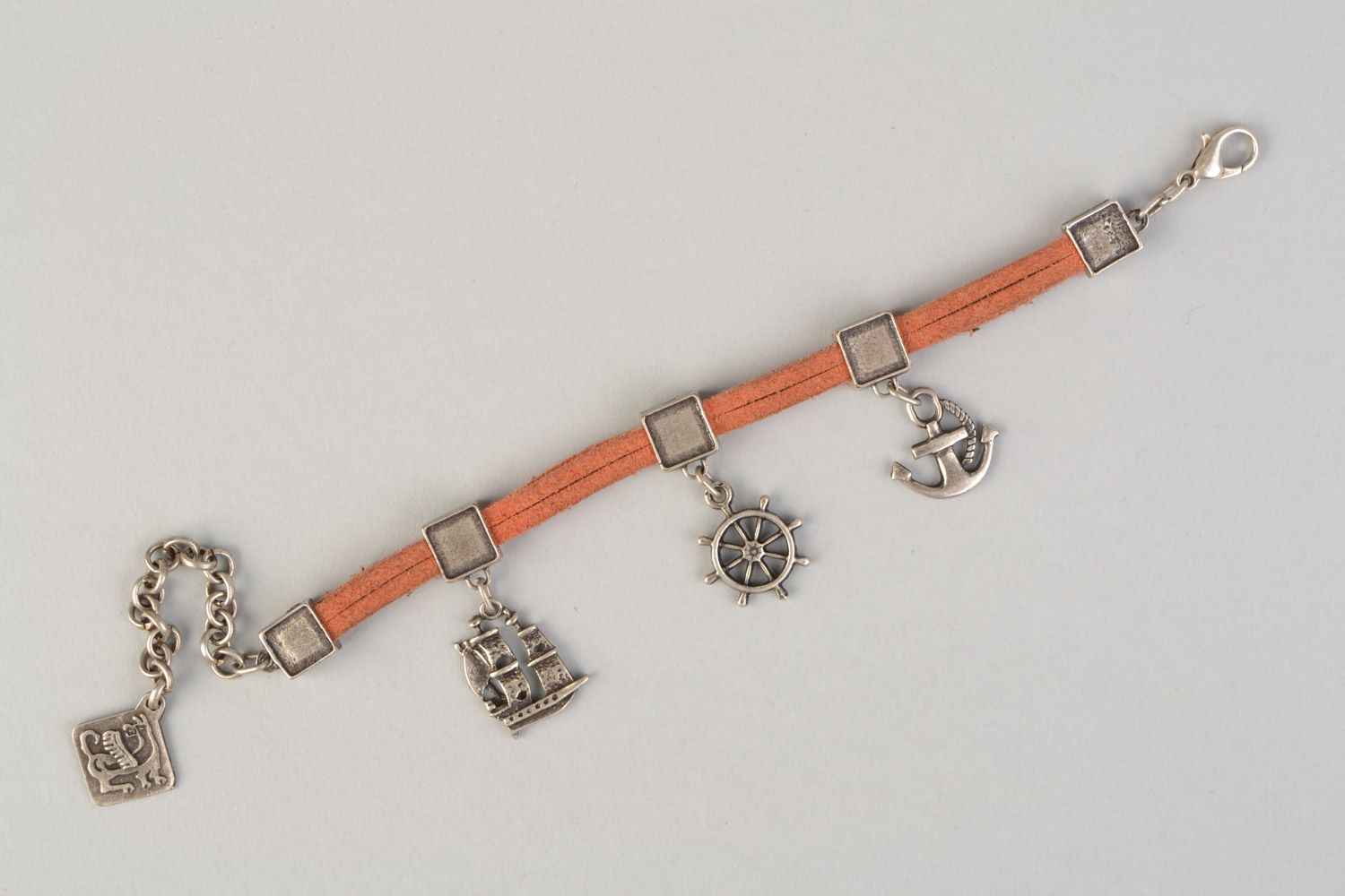 Handmade suede cord bracelet of peach color with metal charms in marine style photo 5