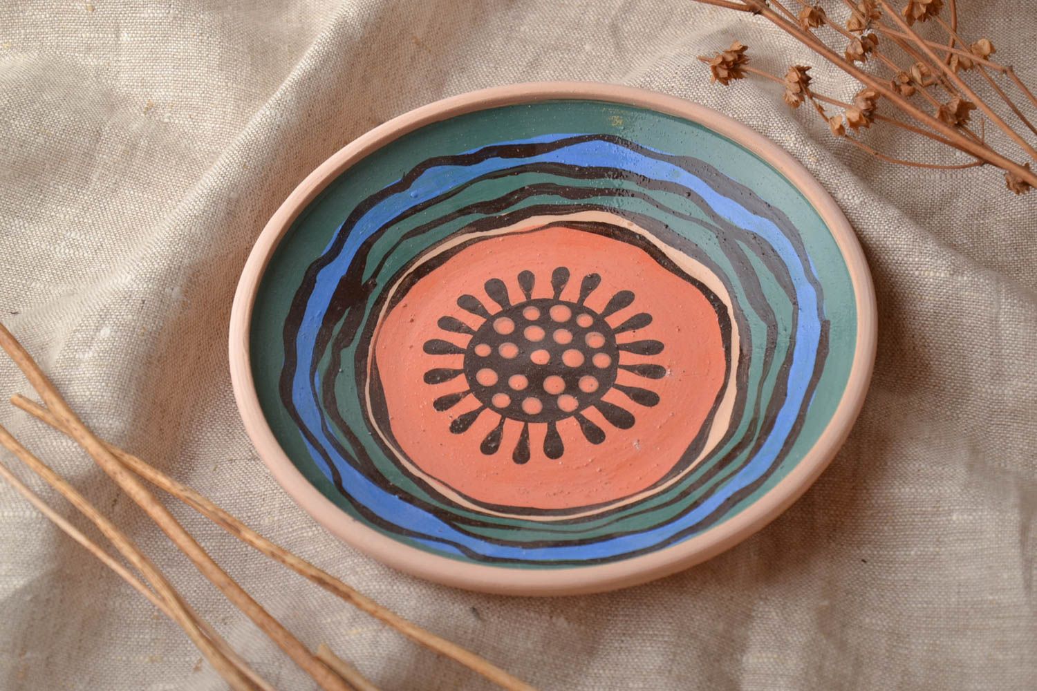 Pink ceramic plate painted with engobes and glaze photo 1