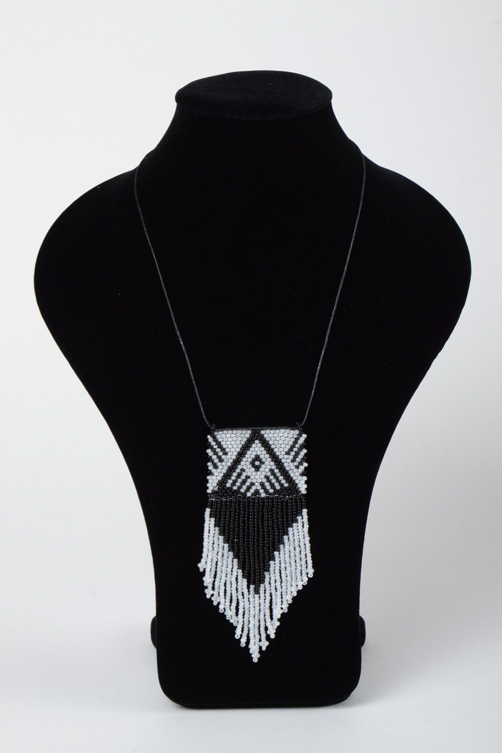 Black and white handmade beaded pendant with fringe and synthetic cord photo 1