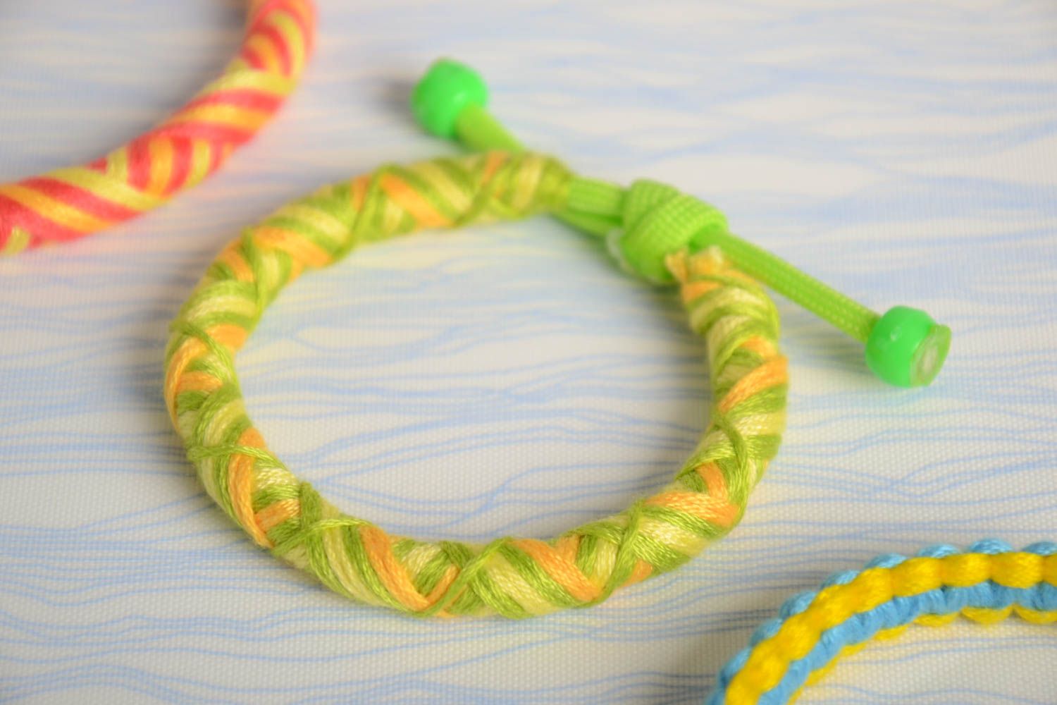 Handmade bracelet made of floss thread and parachute cord beautiful female designer accessory photo 1