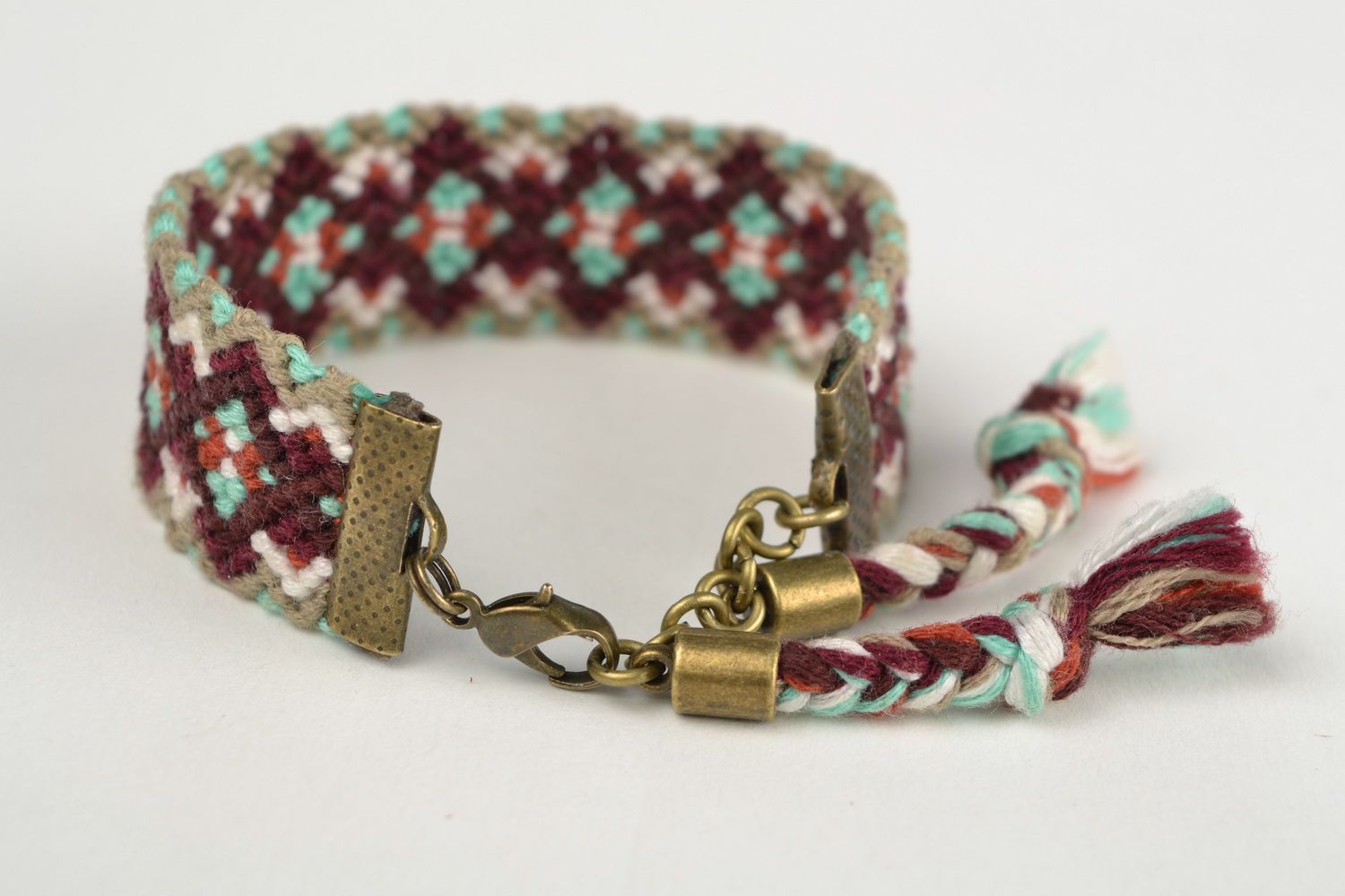 Handmade colorful friendship wrist bracelet woven using macrame technique photo 4