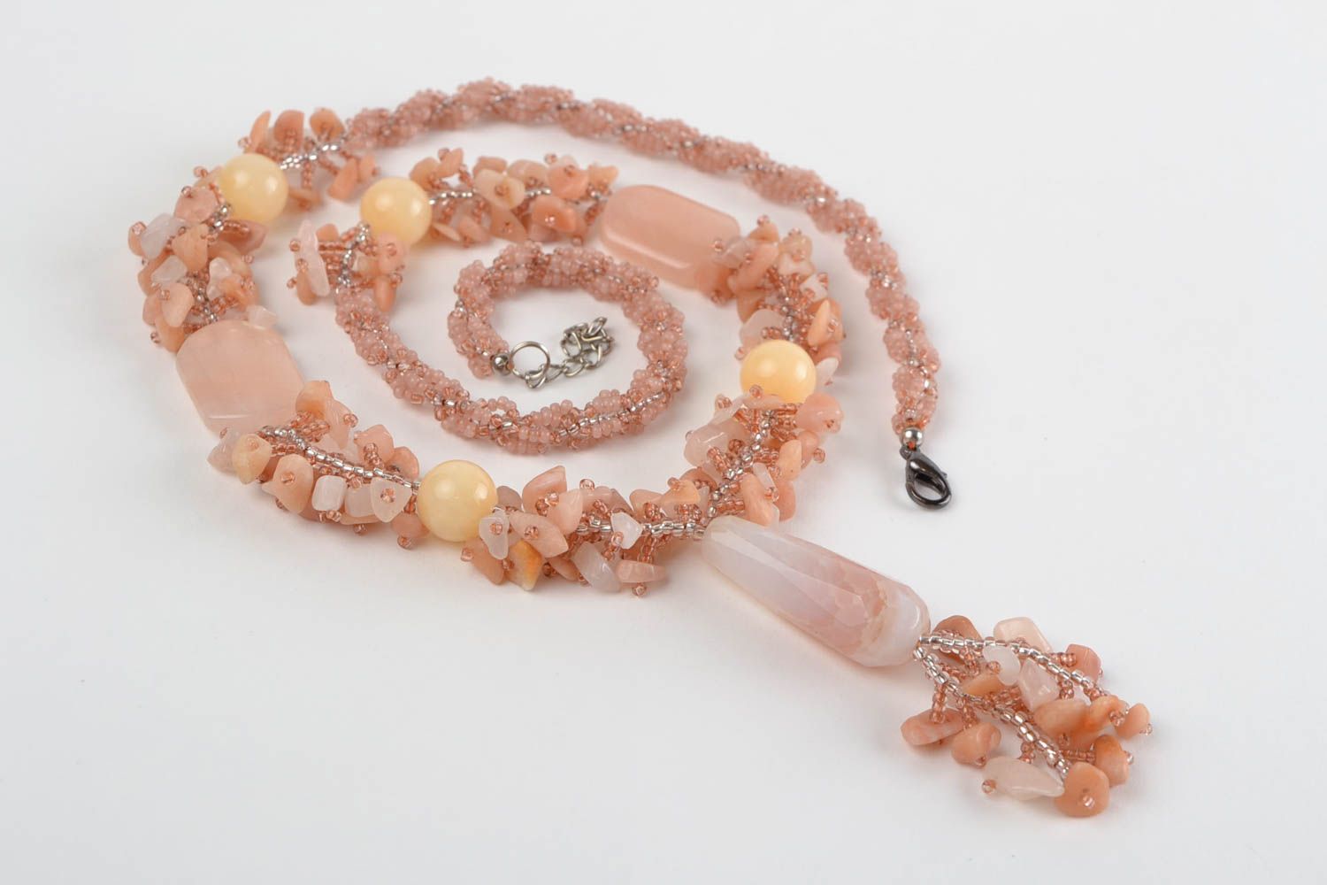 Tender long peach-colored handmade necklace made of beads and natural stones  photo 2
