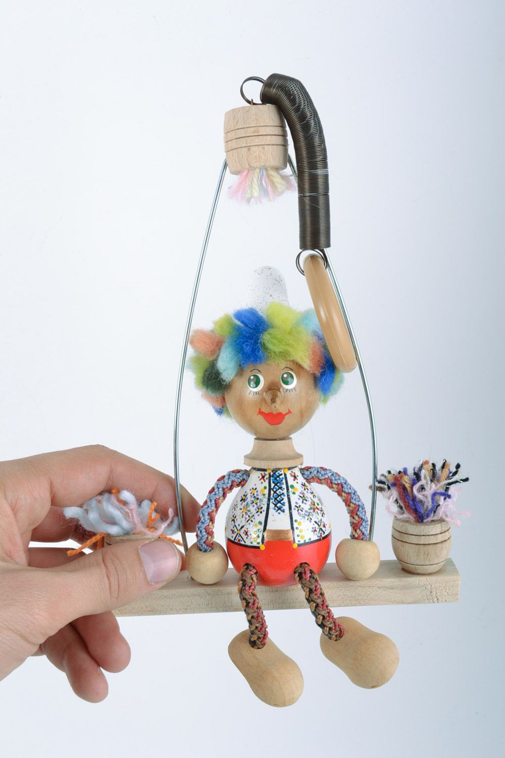 Children's designer handmade wooden toy boy on swing with painting photo 2