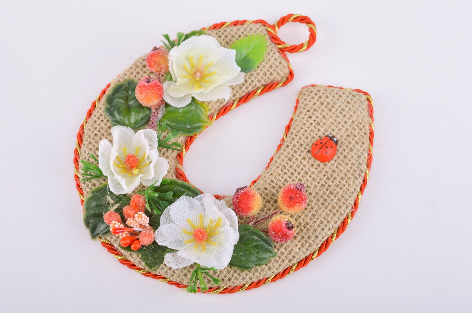 Handmade horseshoe made of burlap with flowers and berries decor and with a loop photo 2