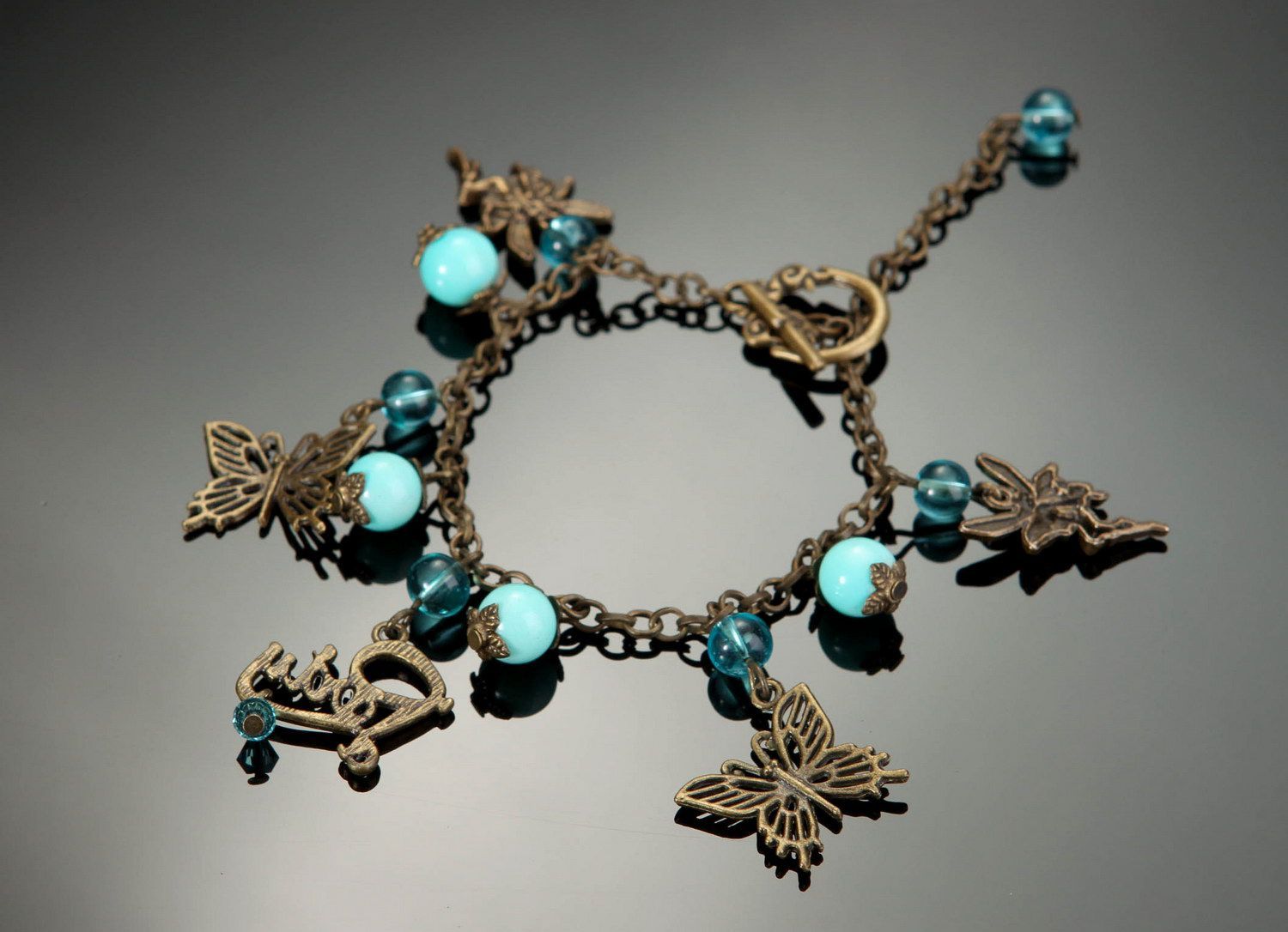 Bronze Armband mit Türkis Schmetterlinge foto 2