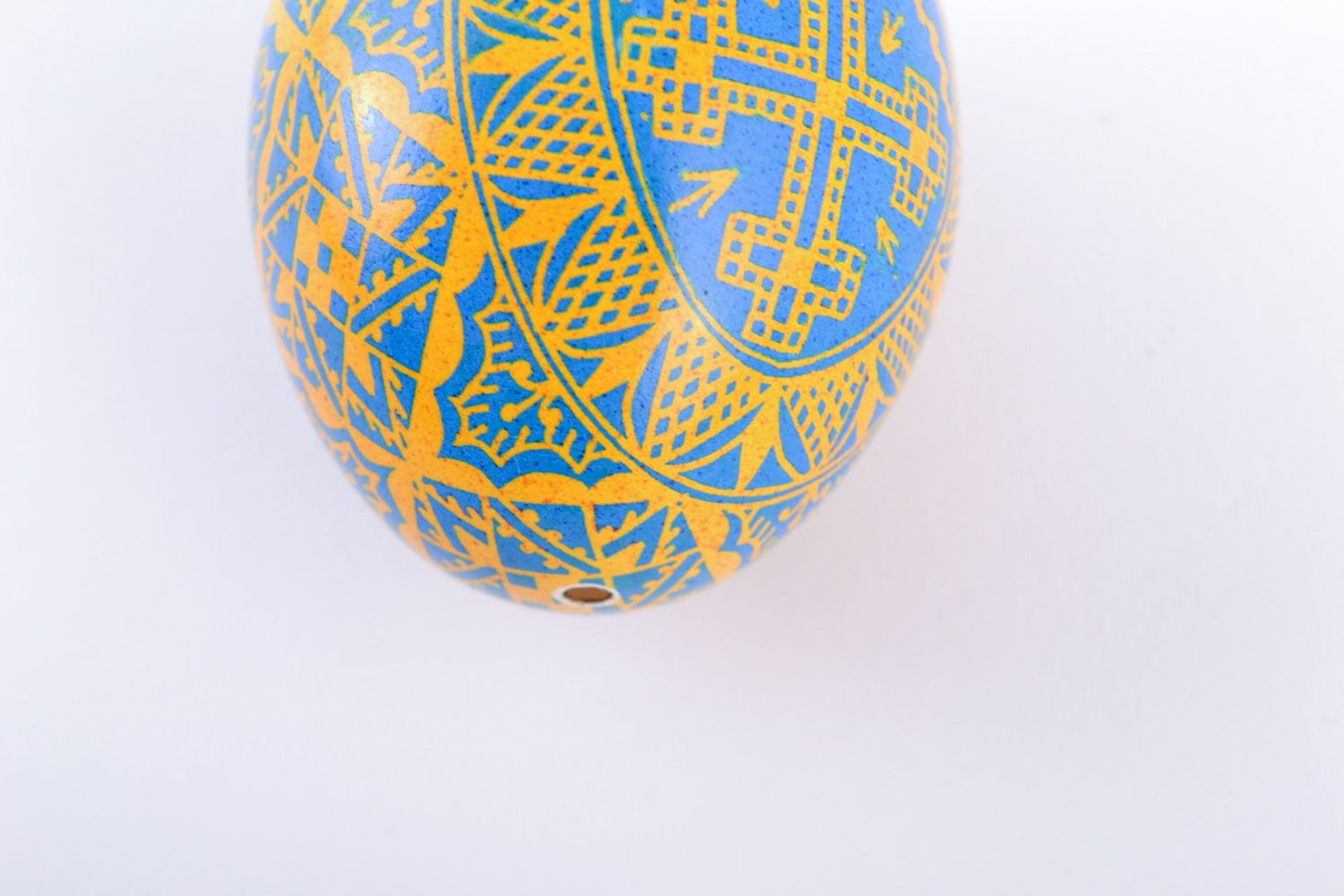 Bright yellow and blue painted chicken egg with cross image for Easter decor photo 4