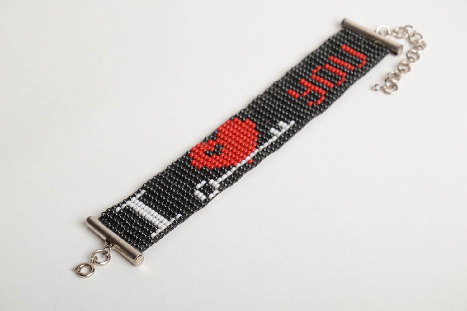 Handmade wide bead woven wrist bracelet with red heart on black background photo 4