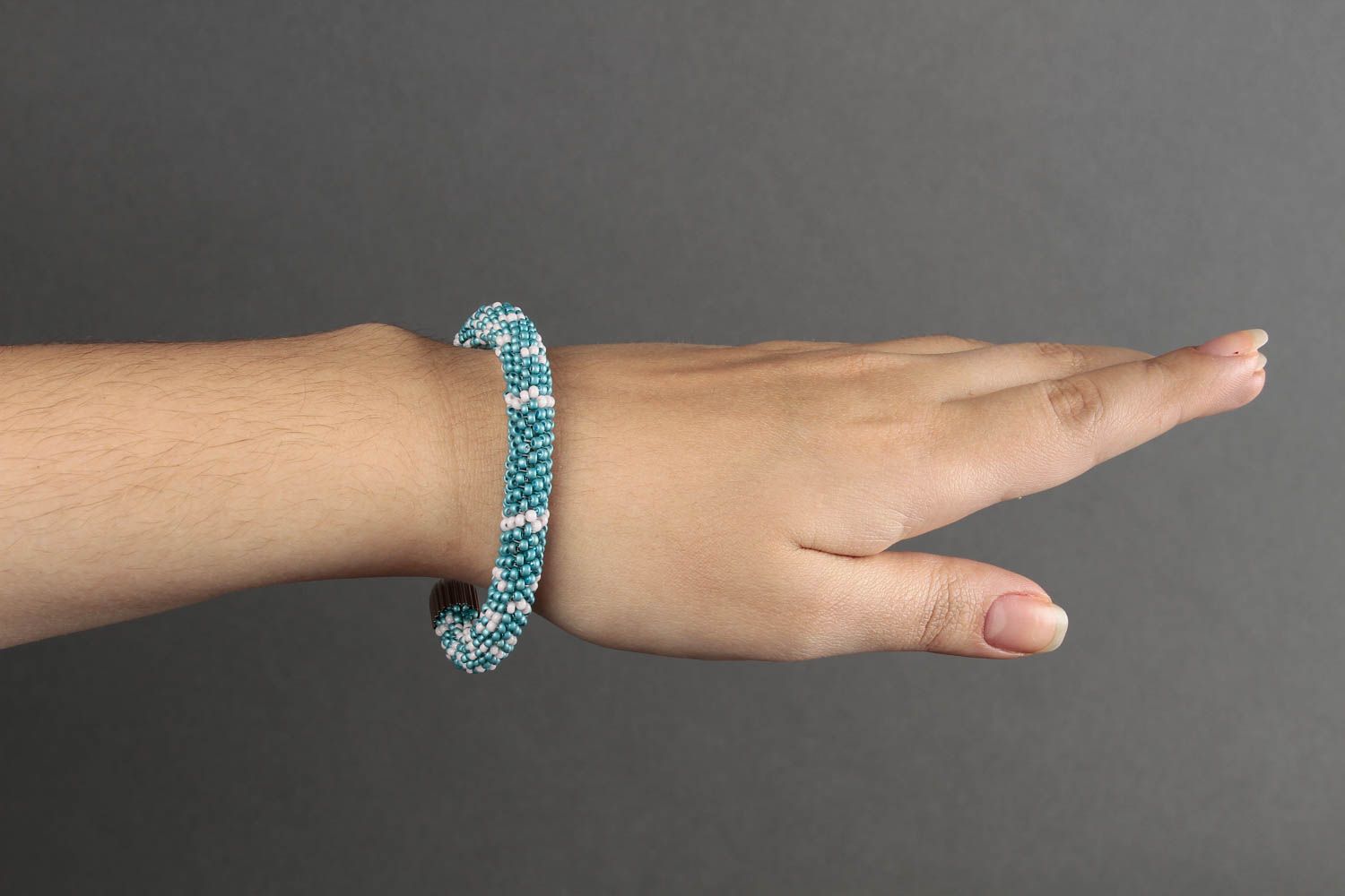 Handmade beaded cord bracelet in turquoise and white beads photo 1