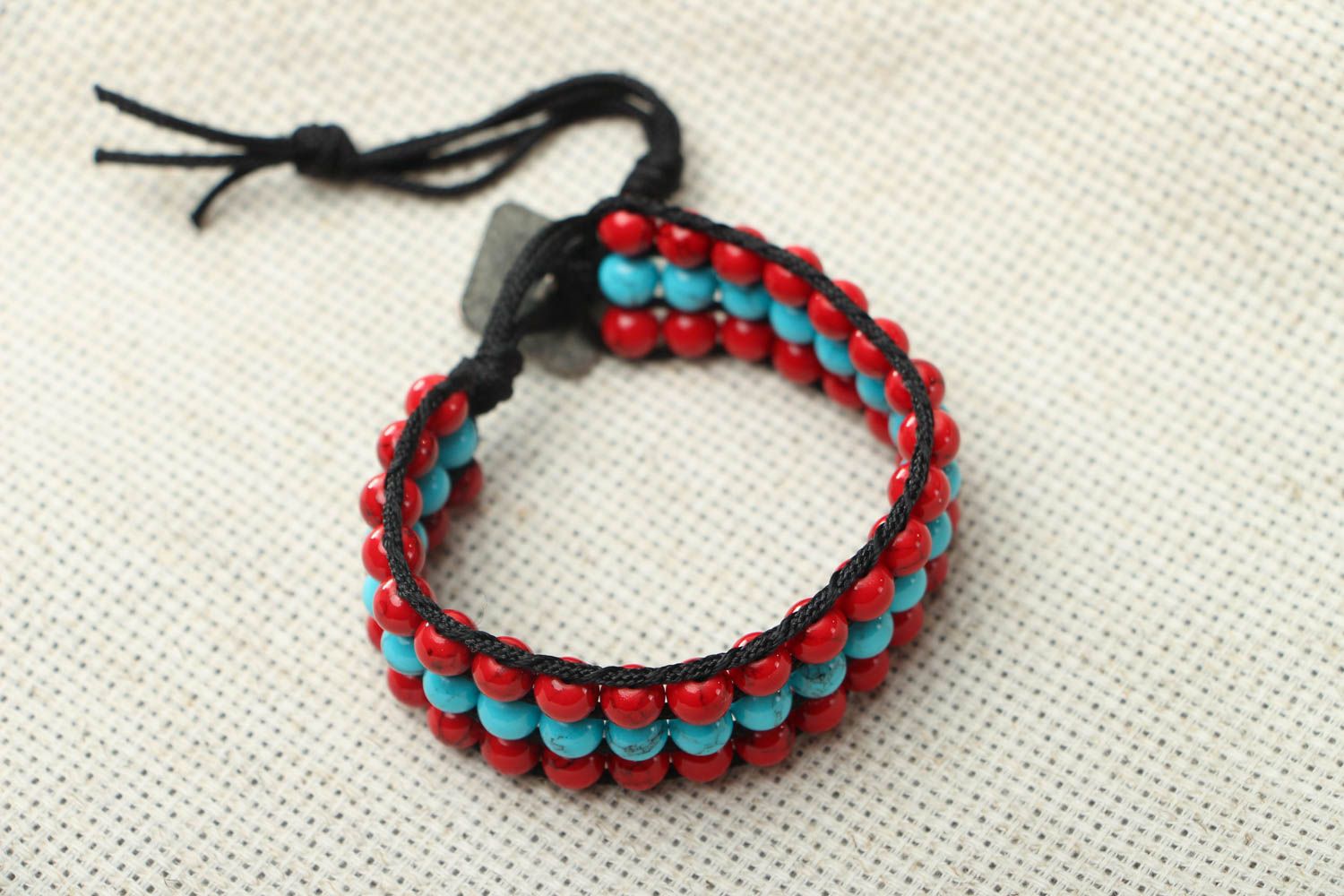 Woven bracelet with coral and turquoise photo 1