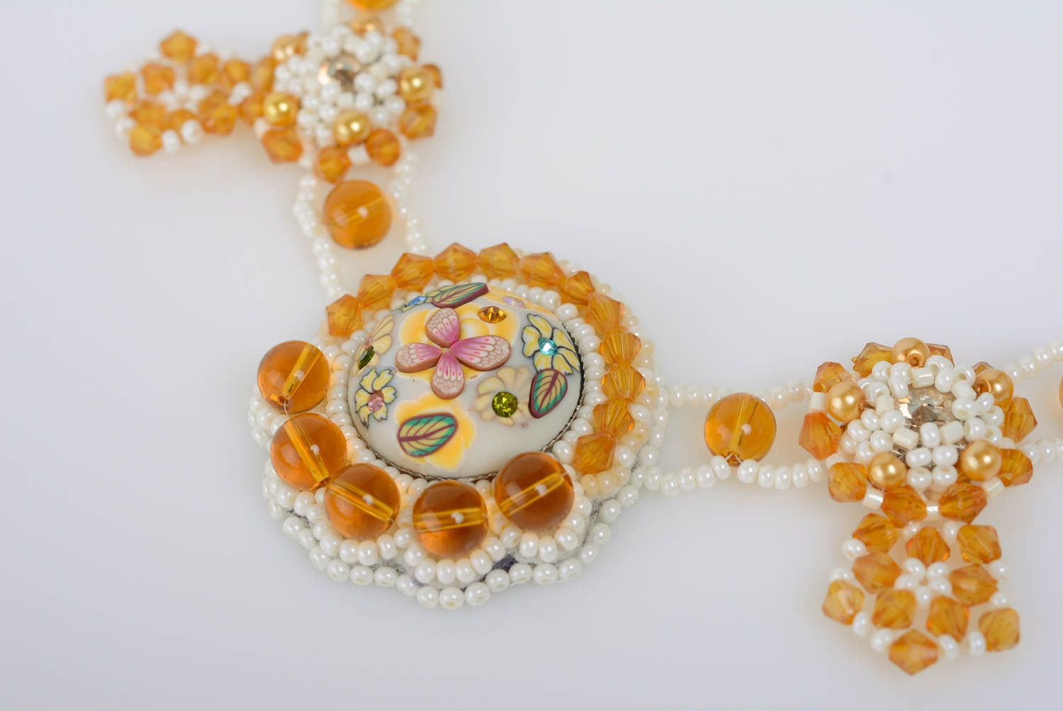 Handmade light bead embroidered white and yellow necklace on chain with crystals photo 2