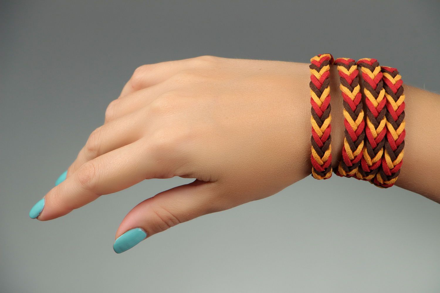 Braided suede bracelet of red and brown colors photo 4