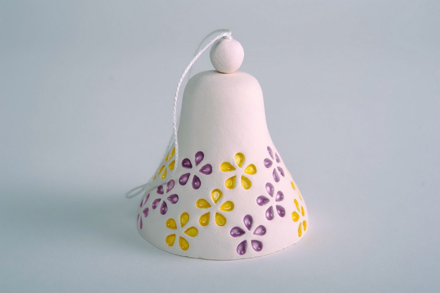 Bells made of white clay  photo 3