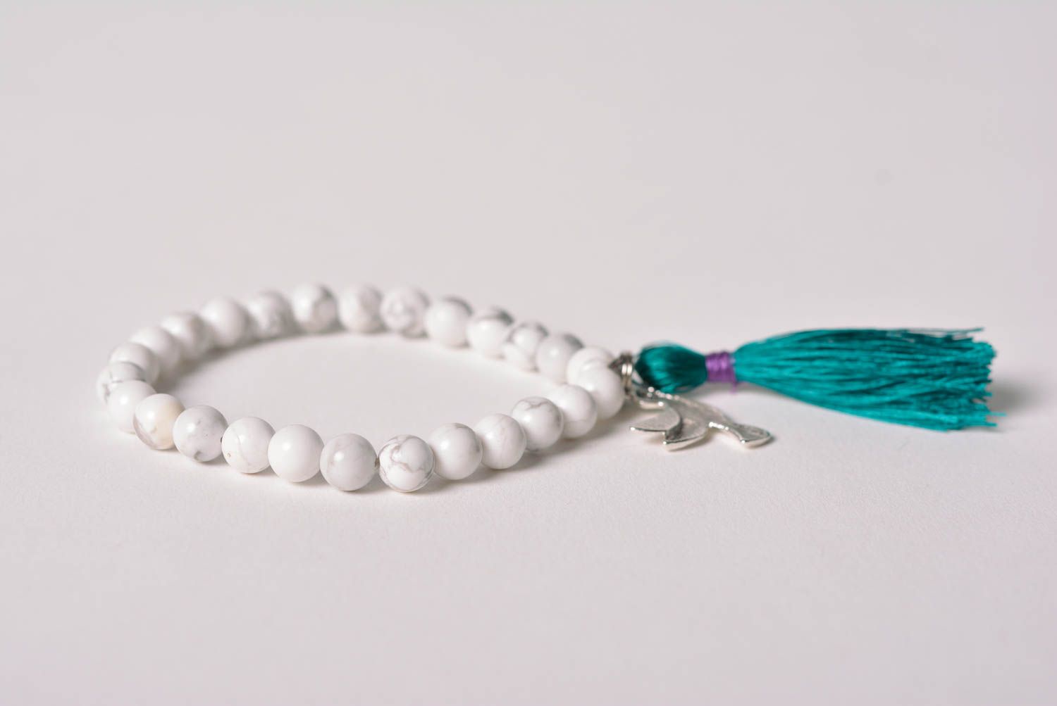 Handmade wrist bracelet with white howlite beads and bright thread tassel photo 4