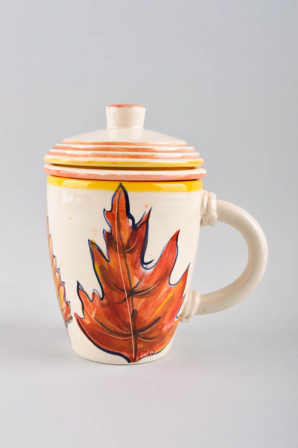 Ceramic cup with lid glazed drinking cup with handle and autumn and yellow maple leaf photo 2
