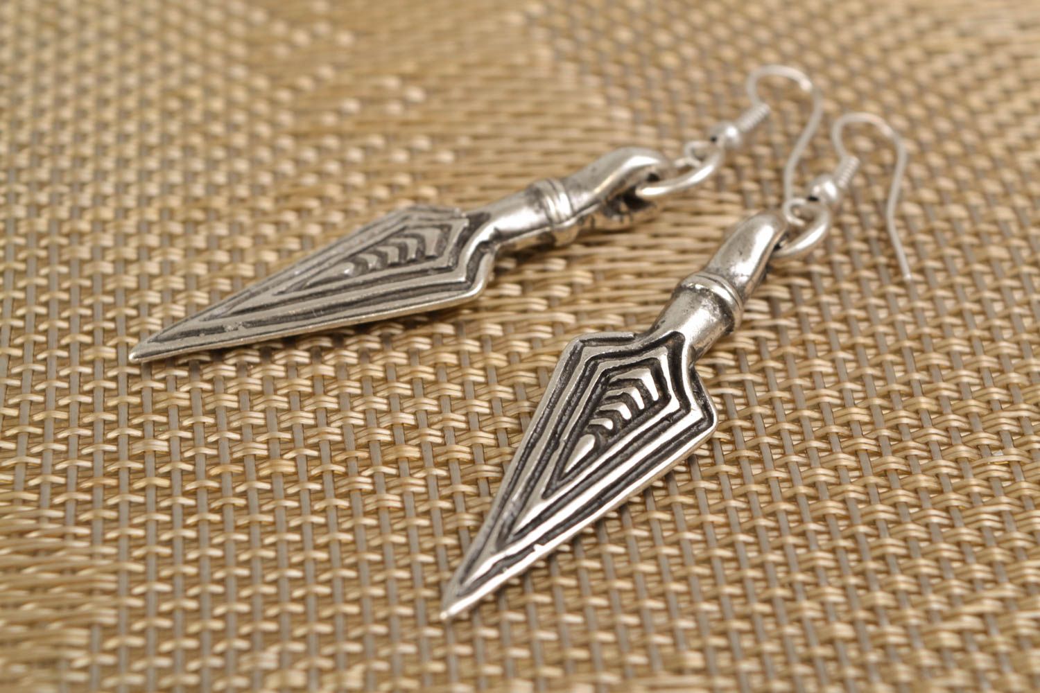 Metal earrings with charms in the shape of pikes photo 1