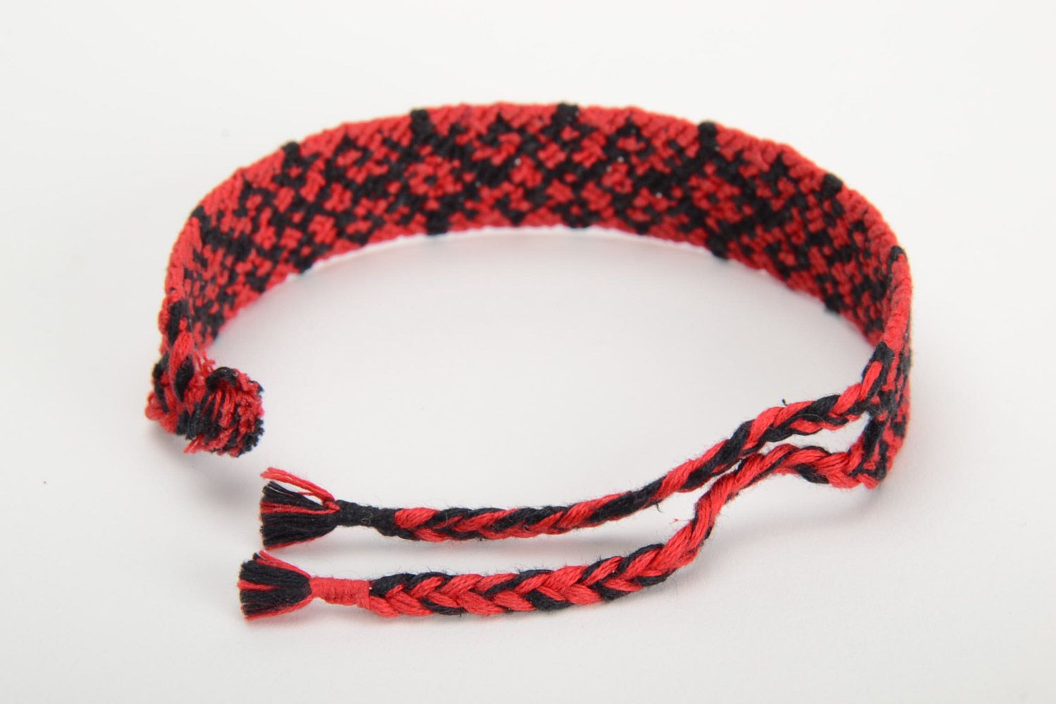 Handmade friendship wrist bracelet woven of threads with red and black ornament photo 3
