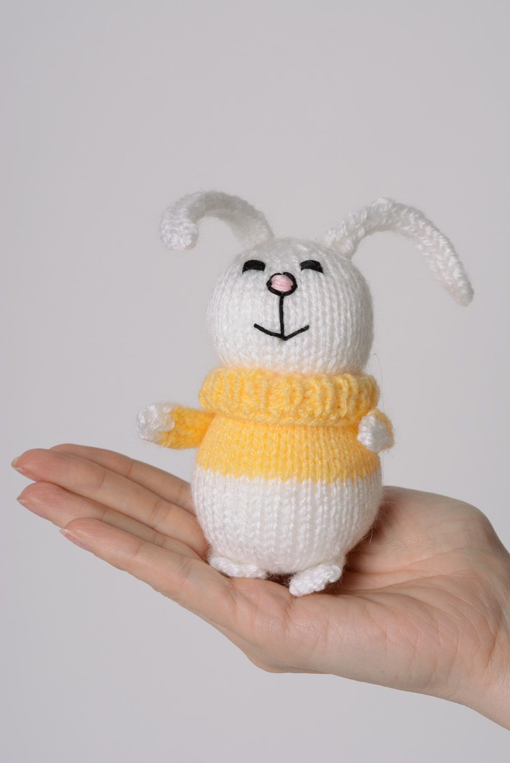 Small funny handmade knitted soft toy hare in sweater for children photo 4