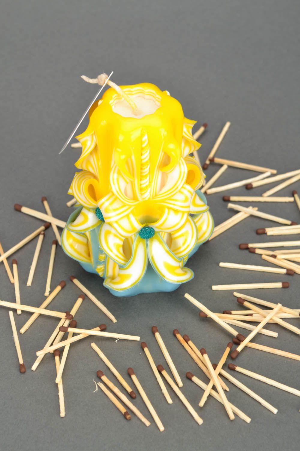 Yellow carved candle photo 1