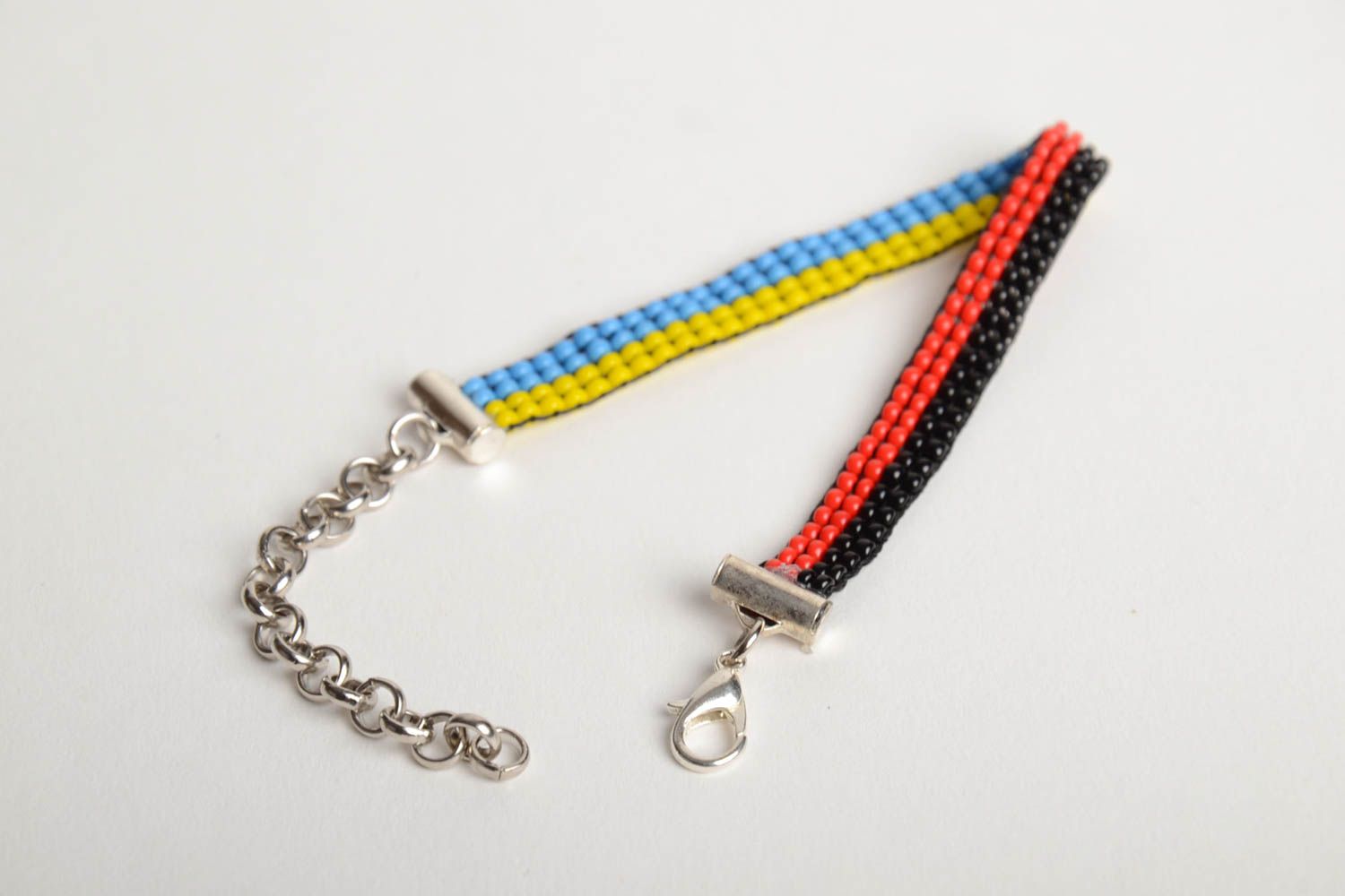 Handmade thin bead woven wrist bracelet black and red yellow and blue unisex photo 4