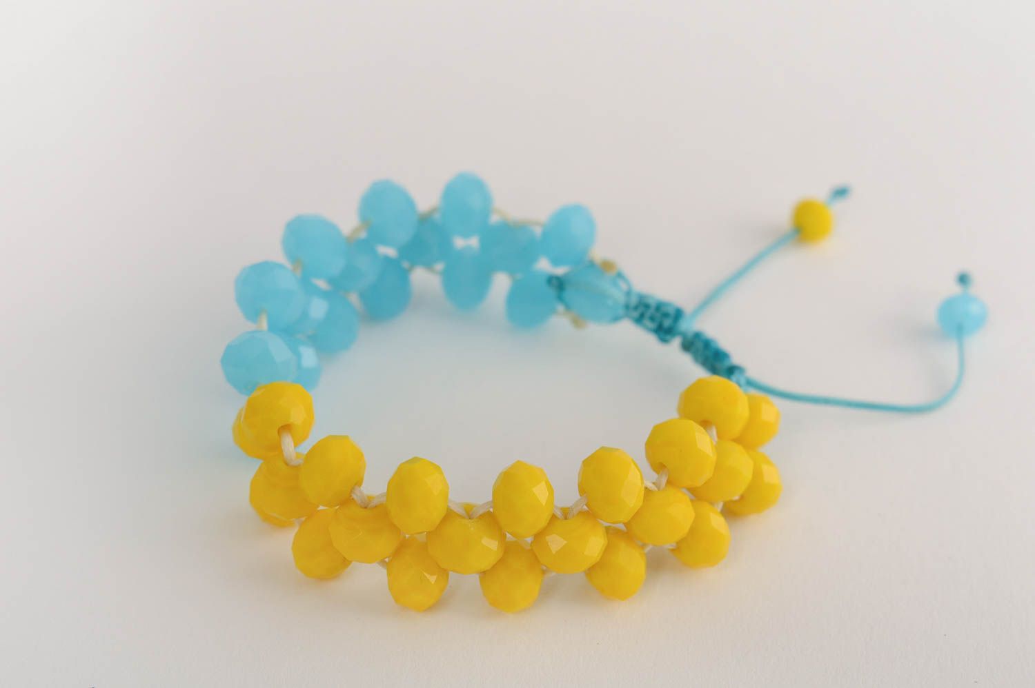 Handmade beautiful blue and yellow bracelet made of crystal macrame technique photo 2