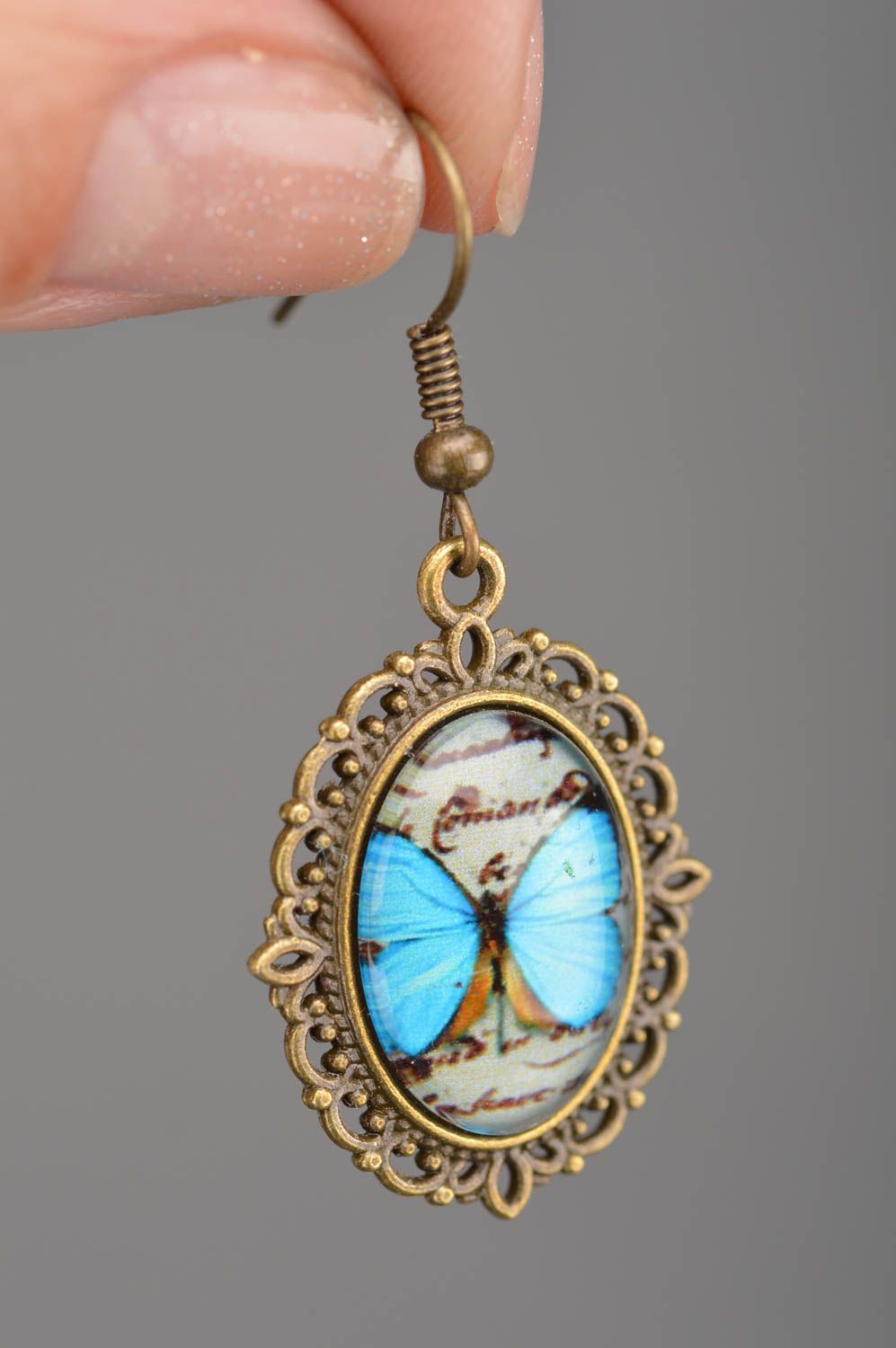 Beautiful stylish vintage handmade oval metal earrings with butterflies image photo 2