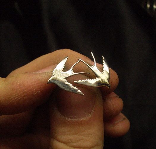 Metal earrings in the shape of birds photo 3