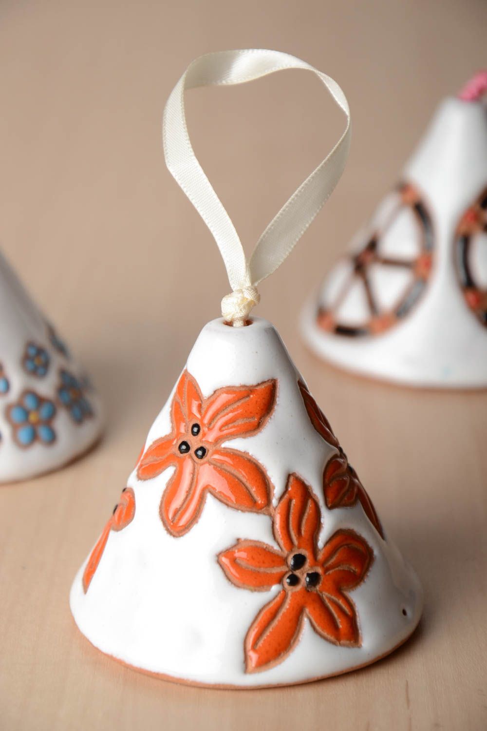 Handmade small ceramic white and orange decorative hanging bell with flowers photo 1
