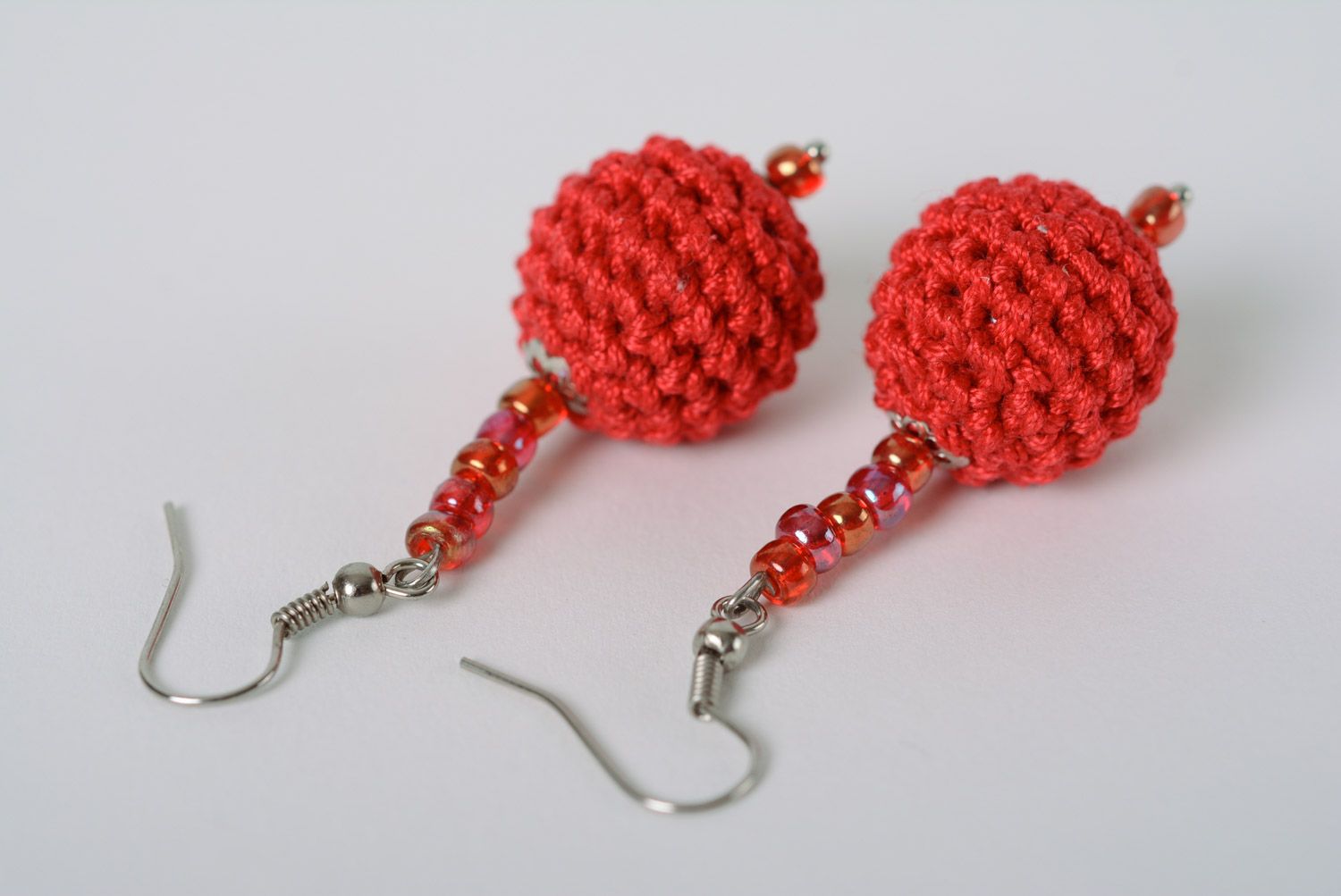 Handmade round dangle earrings with beads crocheted over with red cotton threads photo 4